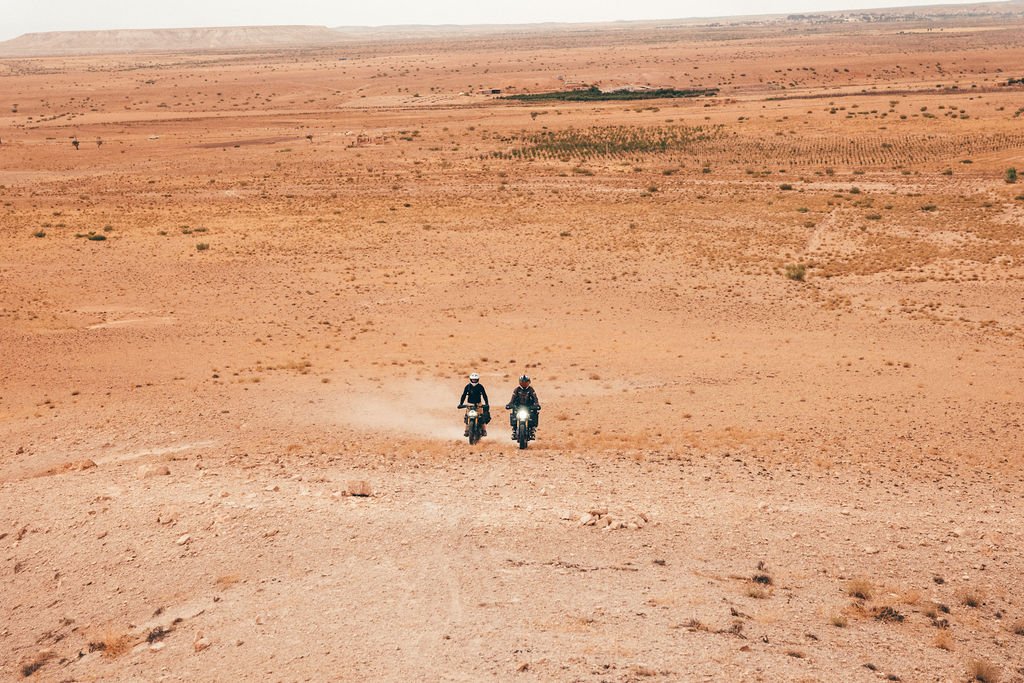 Scrambler riding through the Moroccan desert